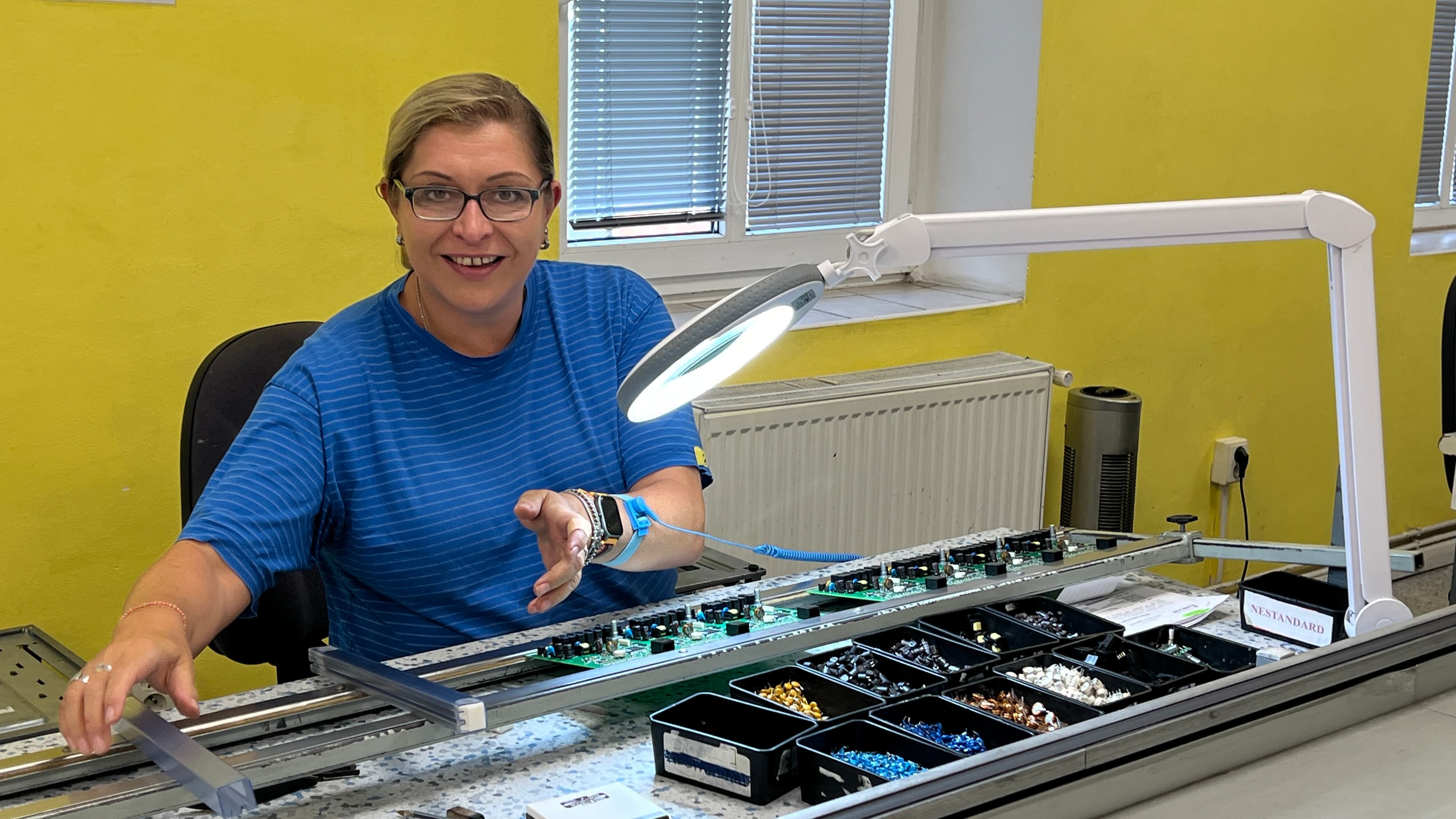 A Virinco engineer working on circuit boards for the Oss Device at a test bench.