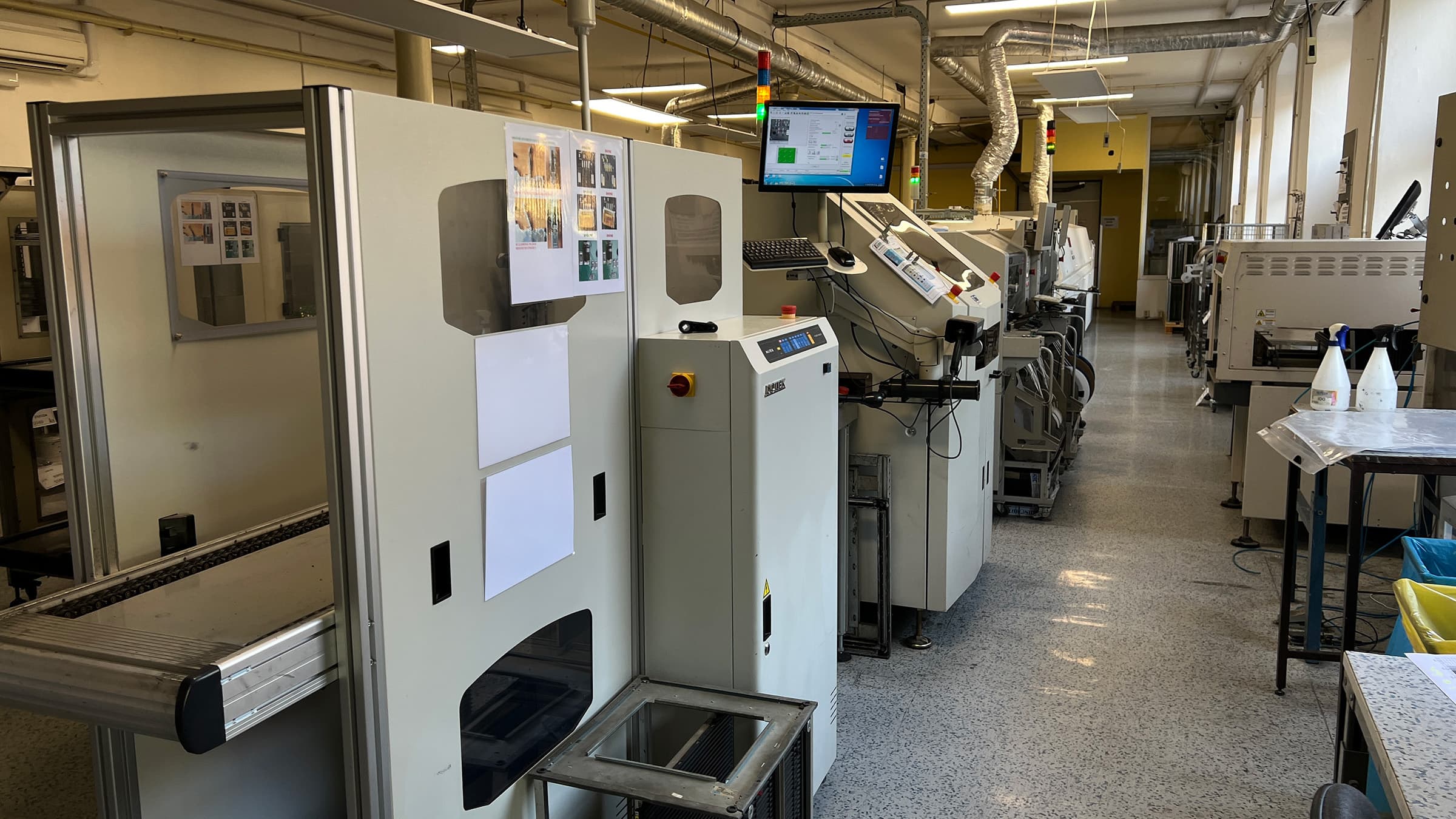 An electronics production line with pick-and-place assembly equipment.